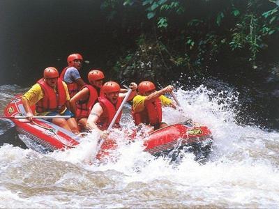 A group of tourists white water rafting in the Ayung River