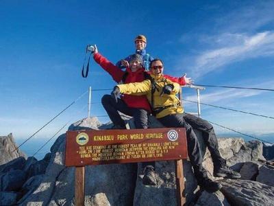 Climbers of Mount Kinabalu posing for picture at the top