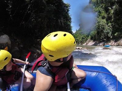 Closeup shot of participants on a white water rafting ride in Gopeng