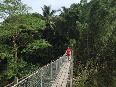 Cycling across the hanging bridge at the countryside of Kota Kinabalu
