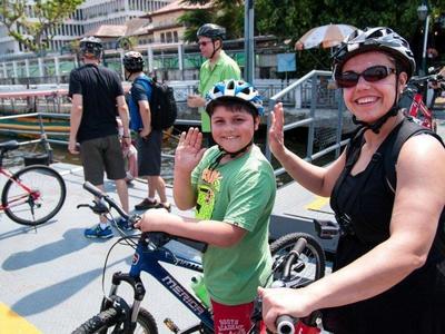 Foreign tourists cycling through the streets of Bangkok