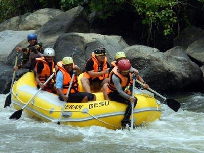 Friends on a white water rafting adventure in Jeram Besu