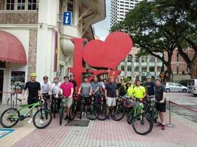 I Love KL signage photo with cycling tourists