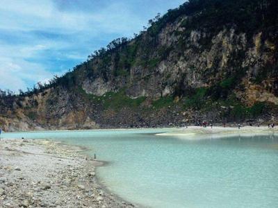 Kawah Putih crater lake at top of volcano