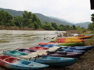 Kayaks put by the riverbanks in Luang Prabang