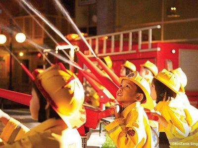 Kids acting as a firefighter in Singapore Kidzania