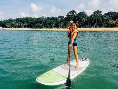 Lady stand up paddling at Chek Jawa