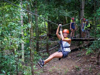 Lady zipping through the forest of Langkawi