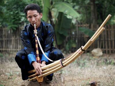 Laos local playing traditional music instrument