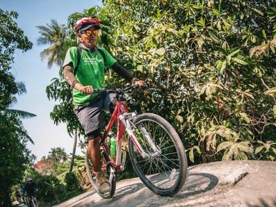 Local guide leading cycling tour at Bangkok countryside