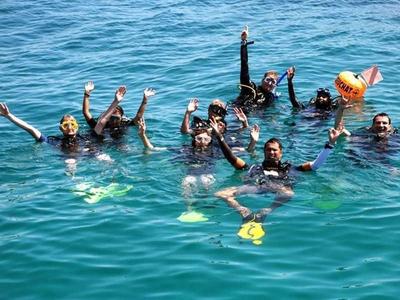 Scuba divers on the ocean at Pulau Tioman