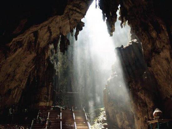 Sunlight shining through the hole into the caverns of Batu Caves