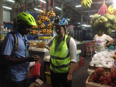 Tourist exploring local fruits in KL