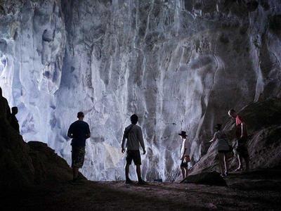 Tourist exploring Pathok Caves in Luang Prabang