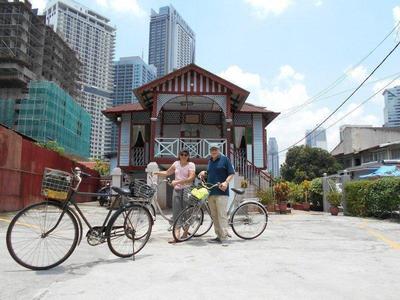 Tourists cycling around Kampung Baru