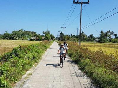Tourists cycling in the roads of Krabi