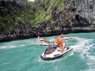 Tourists enjoy jetskiing near the islands of Langkawi