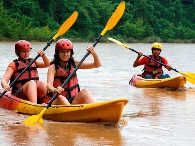 Tourists enjoy kayak at Nam Khan River