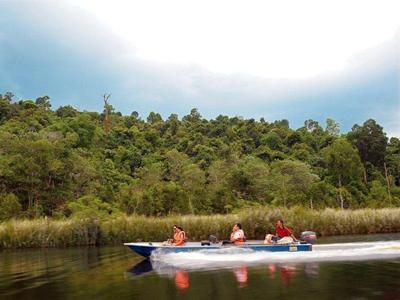 Tourists on a speed boat at Lake Chini
