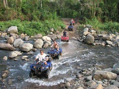 Tourists riding on ATV to Mok Fa Waterfall