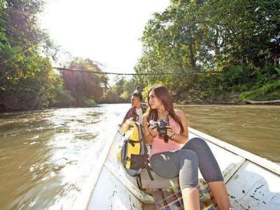 Tourists sightseeing on a longboat at Aiman Batang Ai