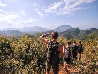 Tourists trekking on hills in Luang Prabang