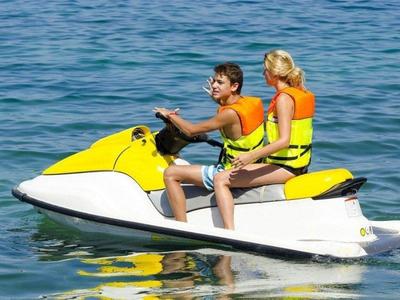Two tourists jetskiing near Cenang Beach
